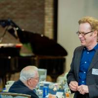 Man and woman talking to each other at Scholarship Dinner 2019